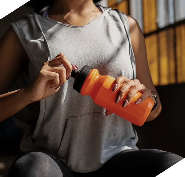 Athlete opening a water bottle